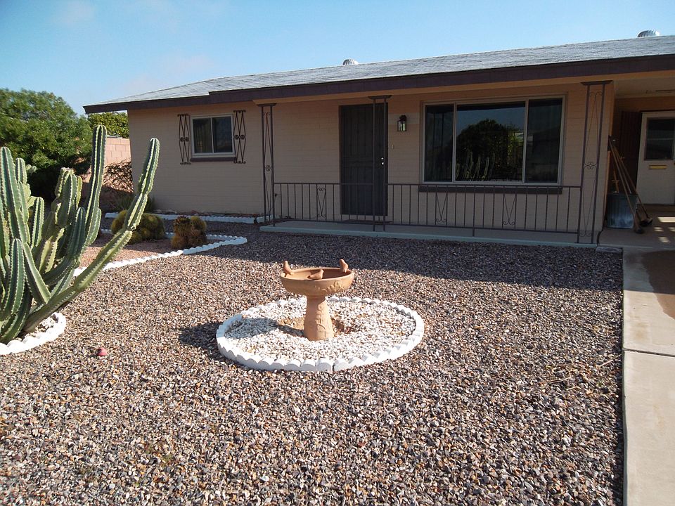 Front of home added table and chairs to sit out front