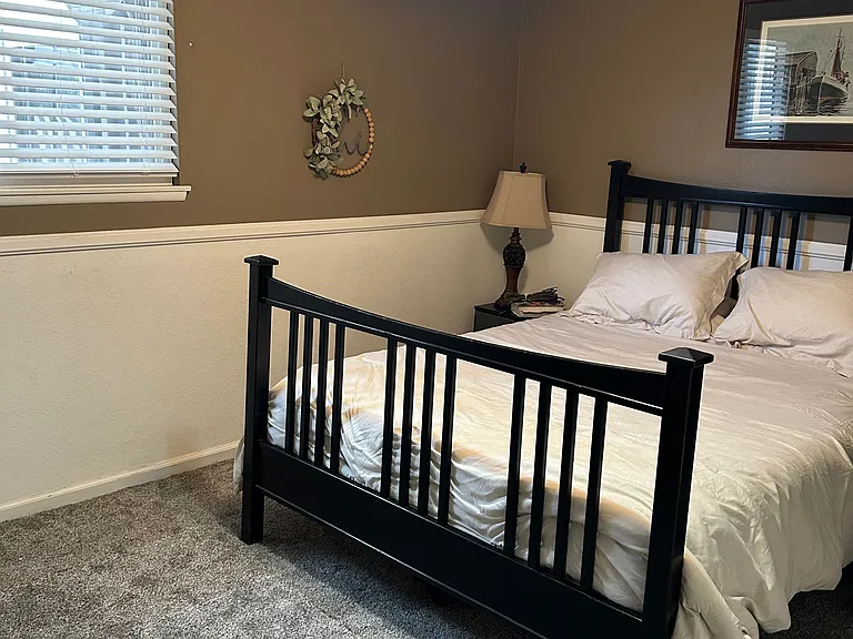 First bedroom with big closet and desk.