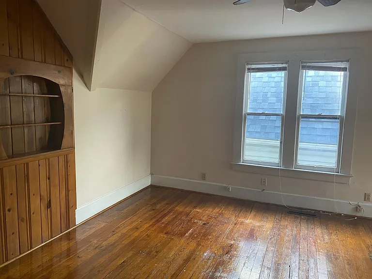 Middle upstairs bedroom also has built-in shelf area