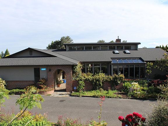 Front of home, partial view of circular drive