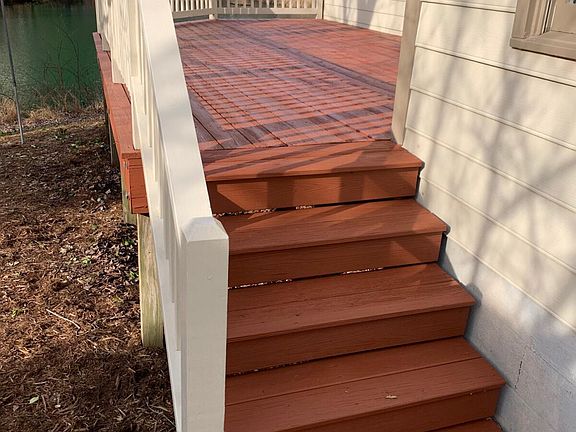 Stairs to the deck; you can also enter from the dining/living room.