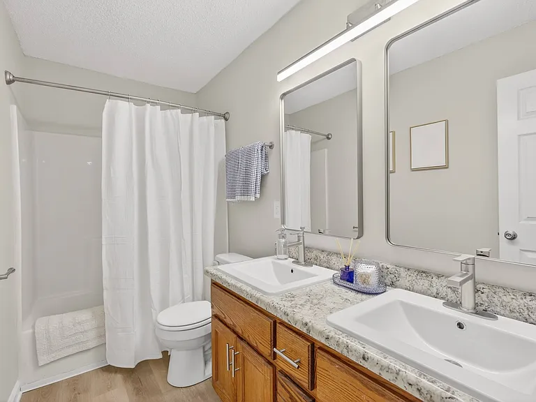 Newly upgraded bathrooms with dual framed vanity mirrors*