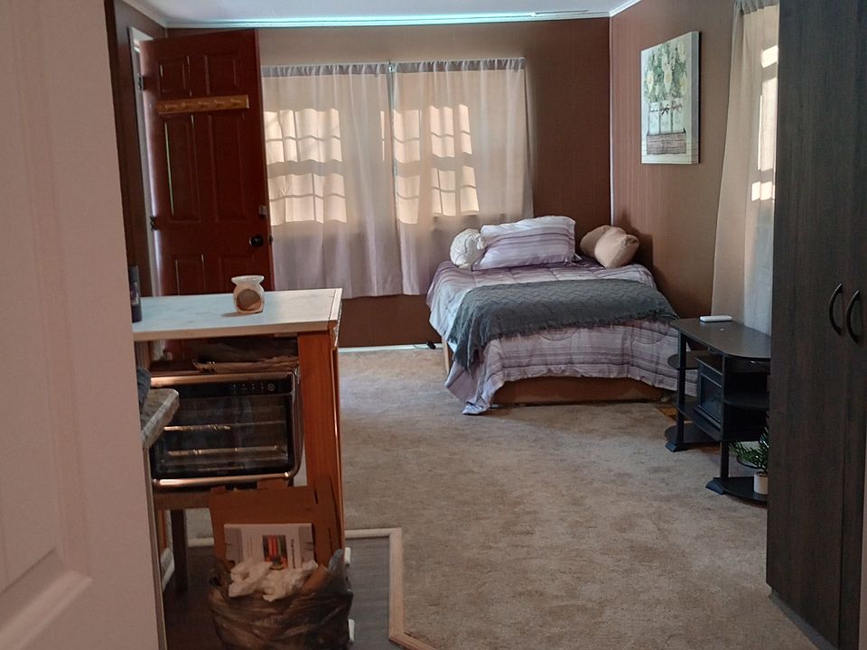 Bed and living area and kitchenette.
