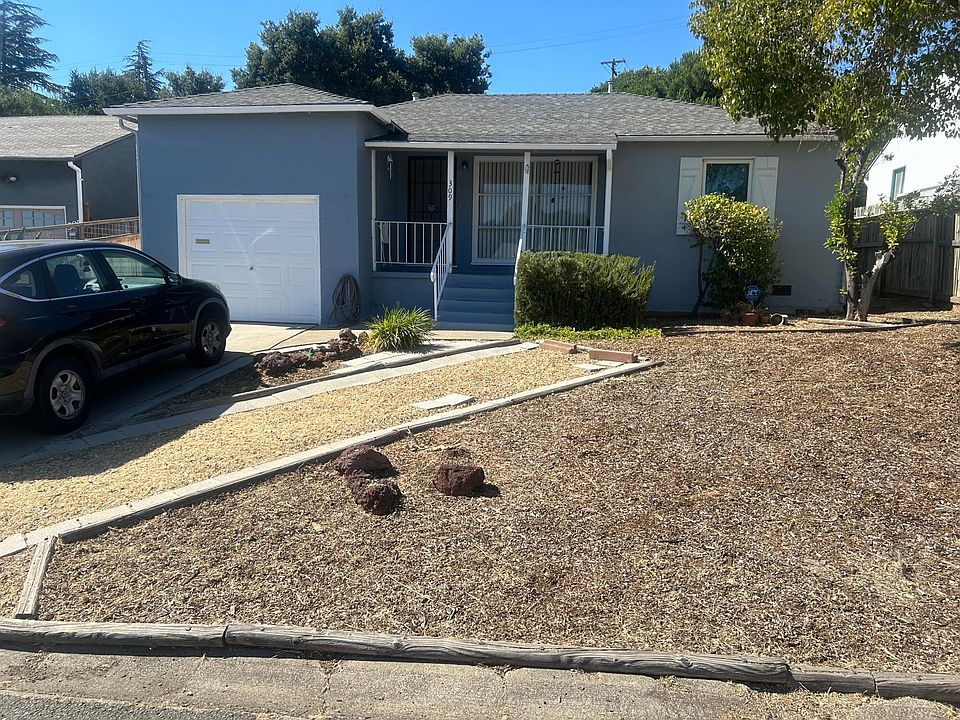 Front of Home with extra parking next to car