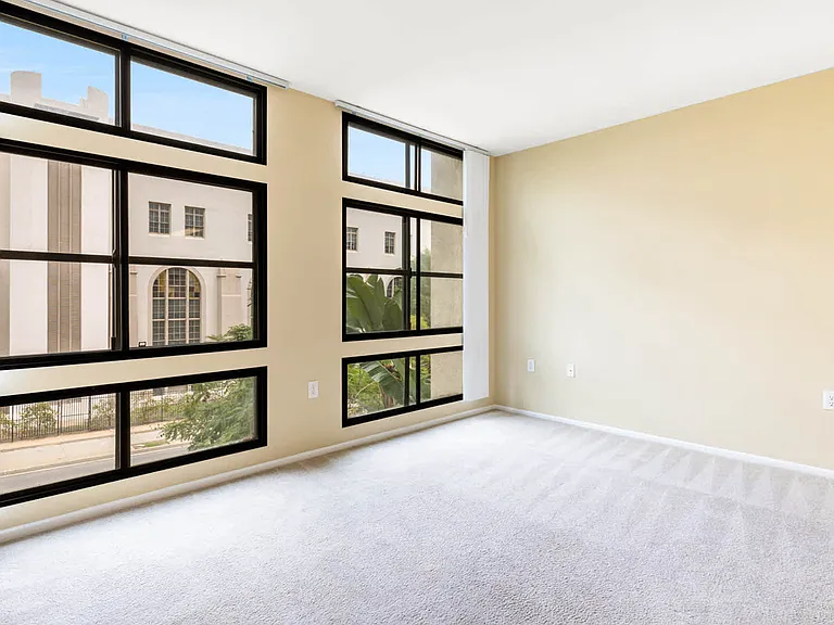 Carpeted Living Room with Floor to Ceiling Windows