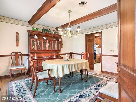 Hardwood floors and beamed ceiling