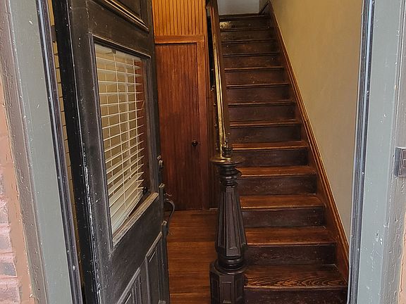 Private 1st floor entrance for 2nd floor unit. Beautiful restored staircase.