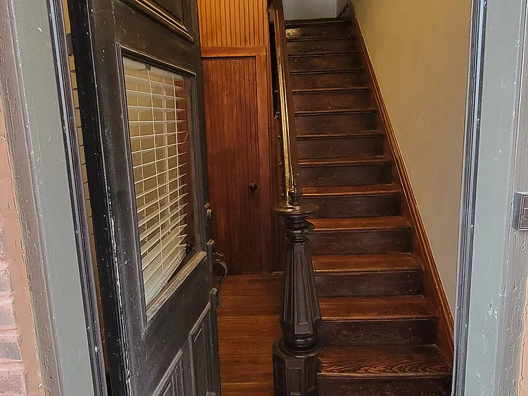 Private 1st floor entrance for 2nd floor unit. Beautiful restored staircase.