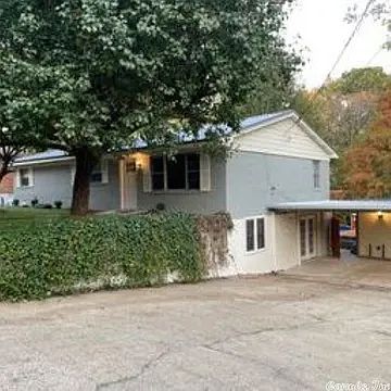 Covered 2 car carport area. French doors to the down stairs.