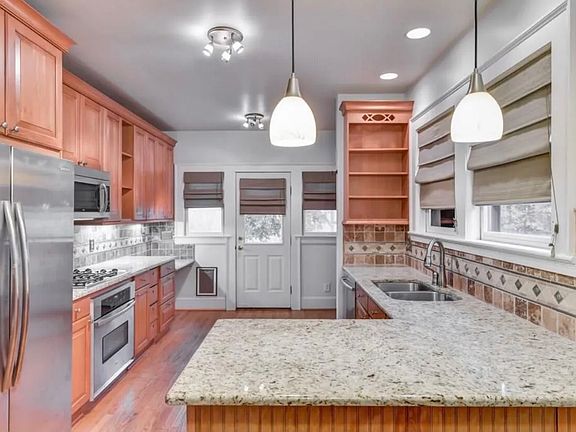 Updated kitchen - stone countertops, gas stove, stainless steel appliances