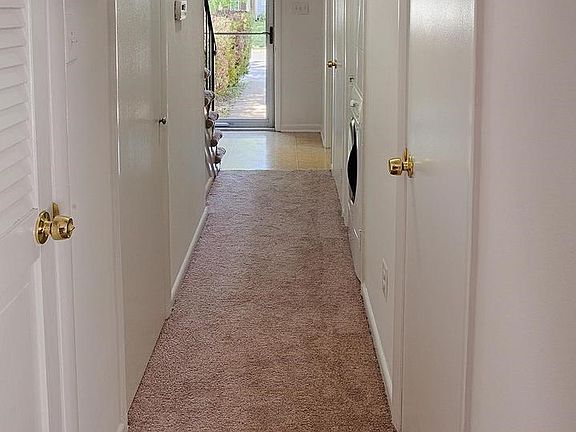 Center Hall, newer carpet leading to main living