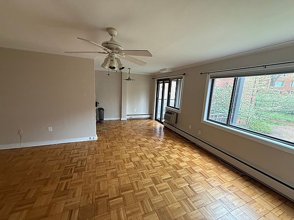 Living area and dining area that opens up to a balcony