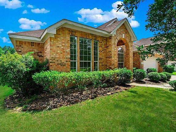 Home has 4 side brick for easy maintenance and 3 car tandem garage.