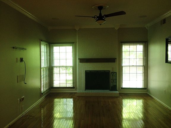 Living room with fireplace, pre-wired for surround sound.
