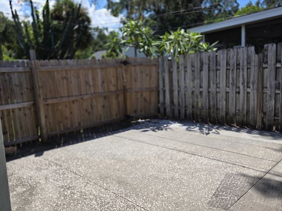 Fenced patio off side of home