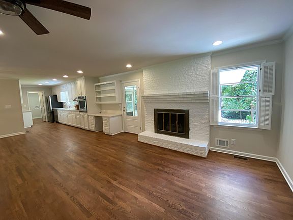 Open Floor Plan of Kitchen, Breakfast area, and sitting area with wood burning fireplace