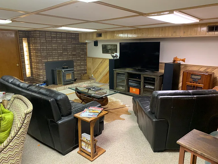 Game room/family room with pellet stove that comfortably heats whole house
