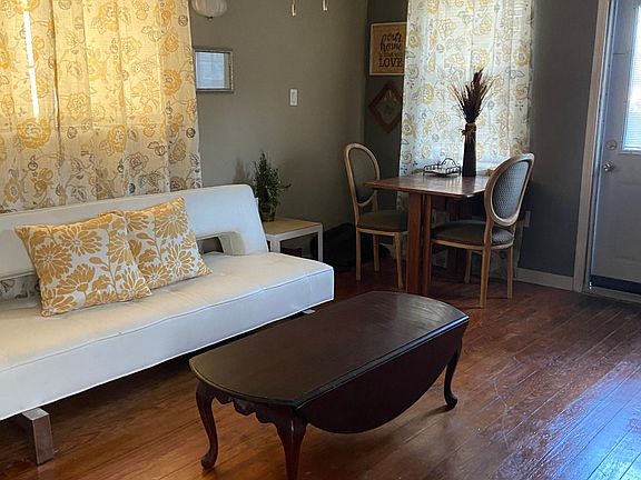 Hard wood floors & futon that makes into a bed for your occasional overnight guest. Coffee table extends when more table space is needed.