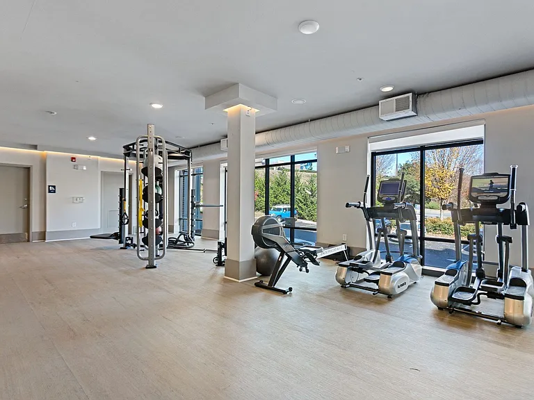 Start your day strong in the cardio zone with ellipticals and a rower framed by natural light