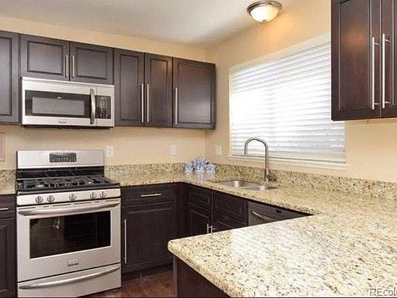 Granite kitchen with stainless appliances