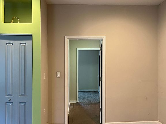 Bedroom to hall and then third bedroom beyond