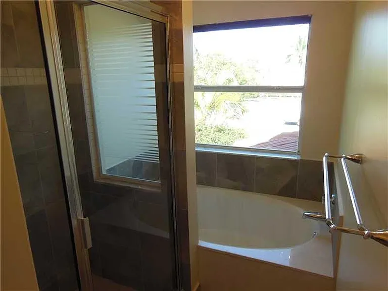 Updated master shower bath and Roman soaker tub to relax.