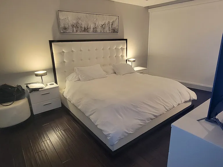 Master bedroom with Italian furniture and built-in electronic blackout blinds