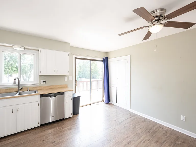 Kitchen with updated appliances, storage, and deck