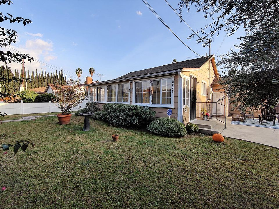 Front of the house. Lush private front yard.