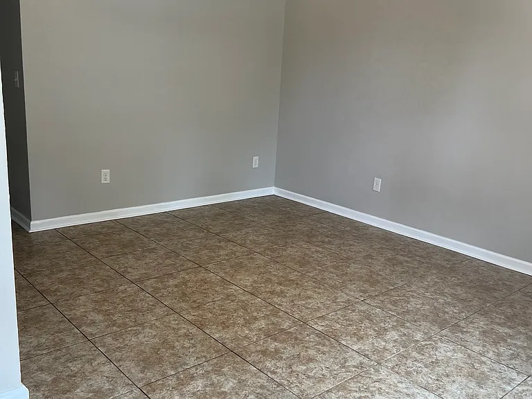 Living room with tiled floor.