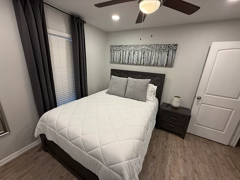 Bedroom 2 - a queen bed and smart tv.