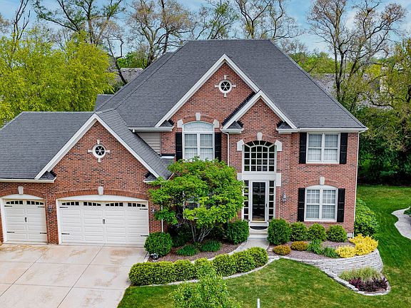 All Brick Front with cedar siding.