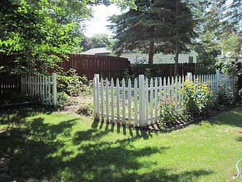 fenced garden plot with strawberries  to enjoy this spring.