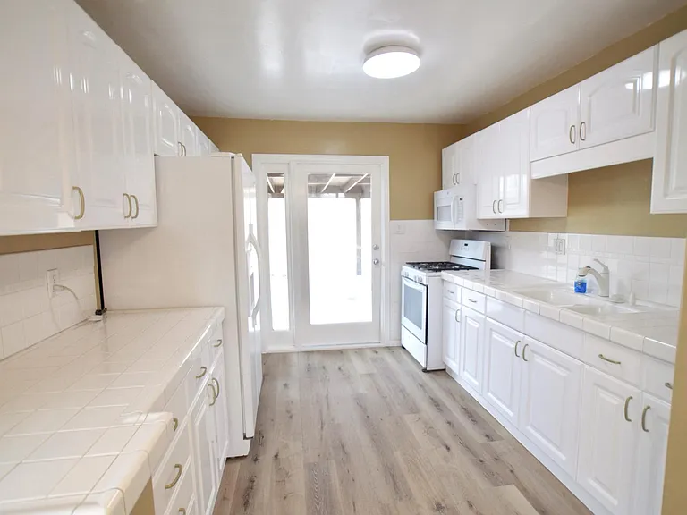 Beautifully Lit Kitchen w/ Access to Backyard/Covered Patio