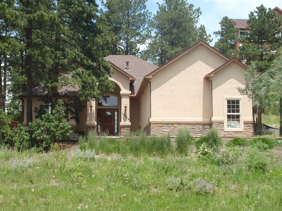 Lot with large trees and mountain views
