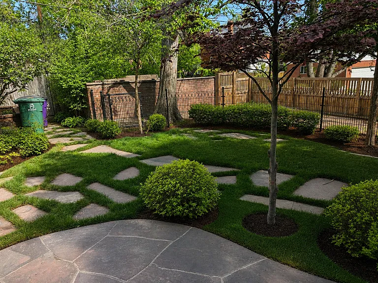 backyard with large patio and dog run.