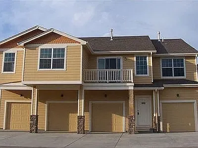Back of condo. 2nd garage from the left is the garage for unit 110