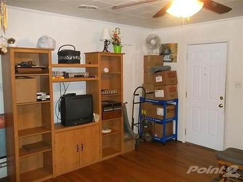 Living room has hardwood floors, walkout.