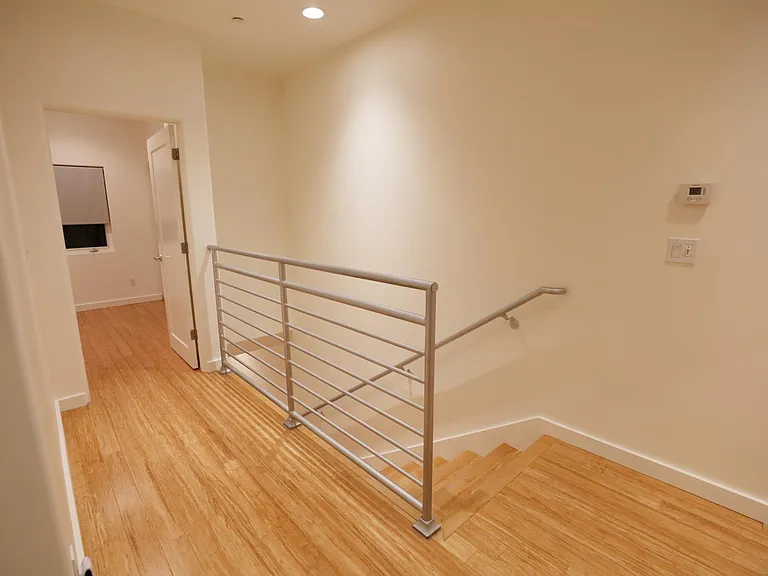 Hallway to Front Bedroom; Landing to Stairway Going Down to Living Room