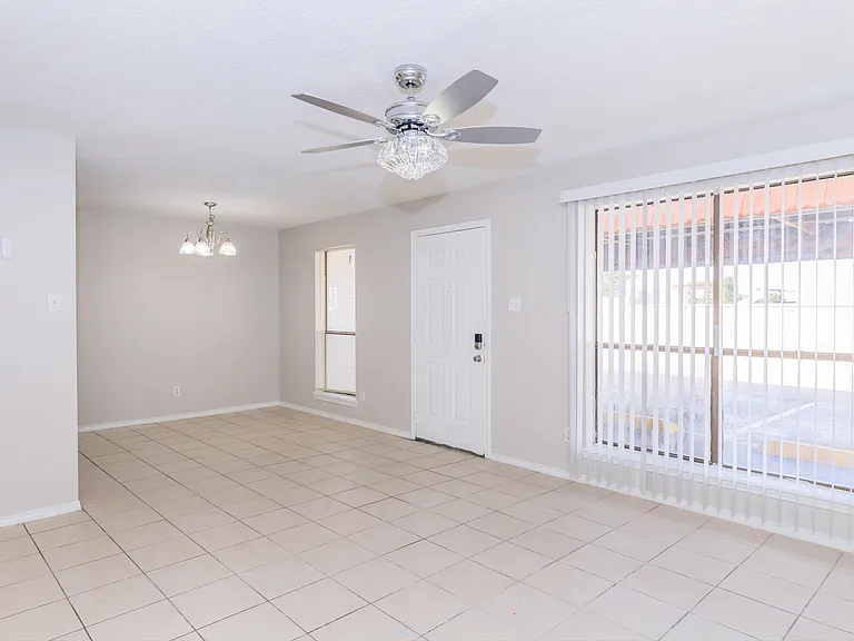 Dining / Living area to our 2 bedroom Apartment, look at our beautiful Crystal fan.