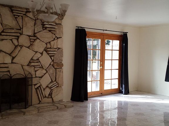 Large den with fireplace