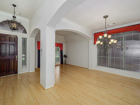 Upon entry, you'll see amazing bamboo flooring throughout both formals.