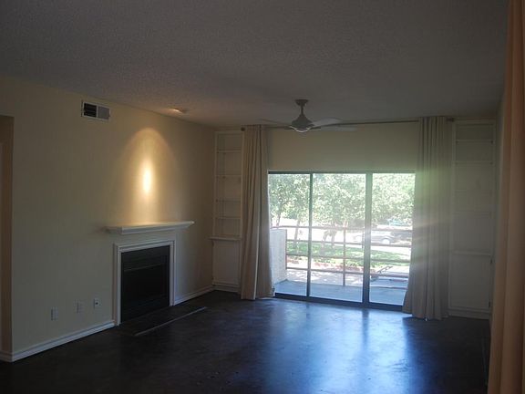 Living room with fireplace and private balcony