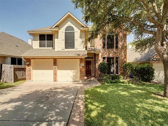 Sprinkler system keeps the landscaping lush in the summer heat. No dragging hose around.