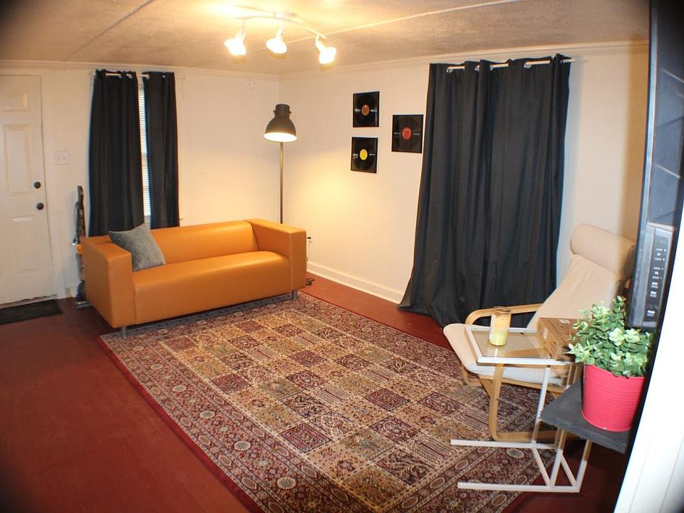 The spacious living room, complete with a flat screen TV as