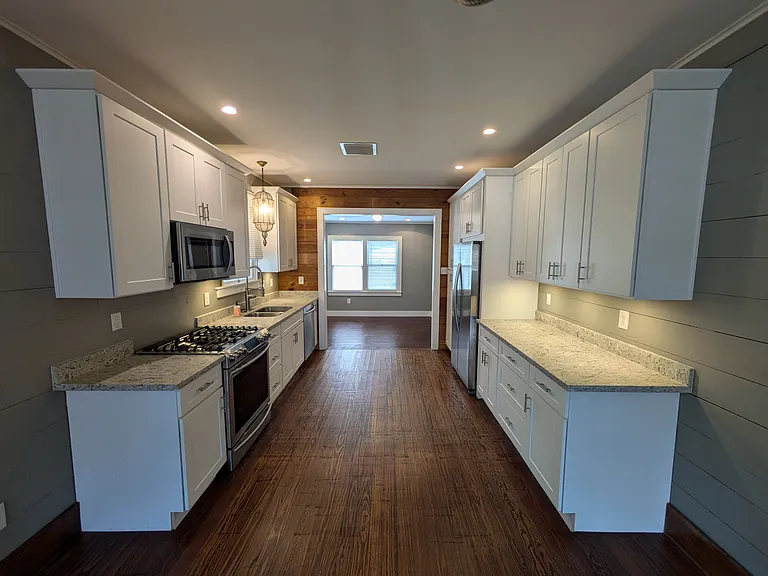 Great galley kitchen with lots of counter space, soft close cabinets, pull out drawers, recessed and under cabinet lighting and premium appliances.