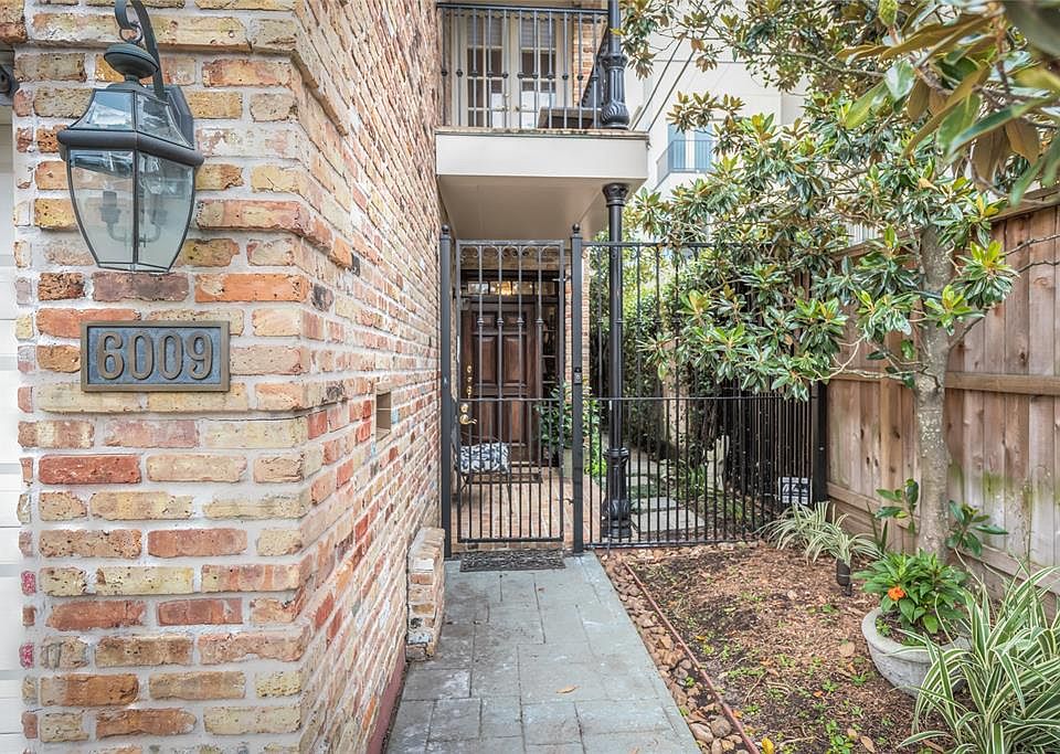 The home has a private gated access to the front door and the side patio and yard. The balcony above the entrance door is accessible from one of the secondary 2nd floor bedrooms.