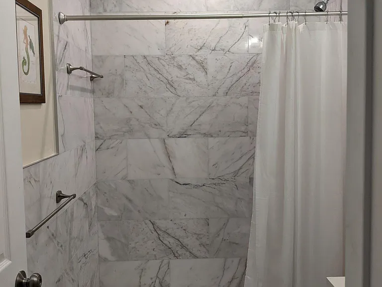 White Marble Shower in the Bathrooms.