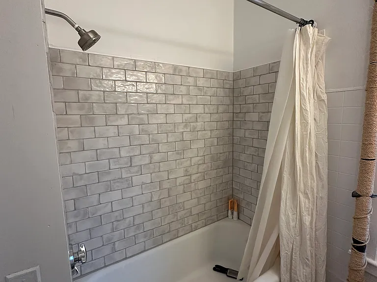 Newly tiled bath.
