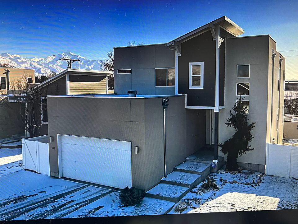 Front of property, concrete pad is 3 cars wide.